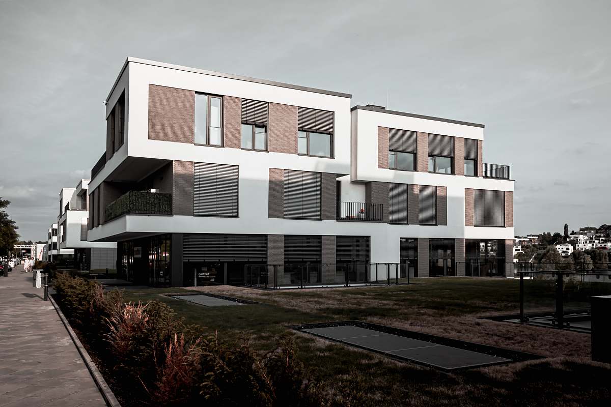office building white and grey painted concrete building condo
